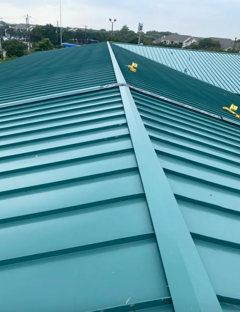 Green commercial metal roof ridge and valley for Metal Roof Repair in Forestville